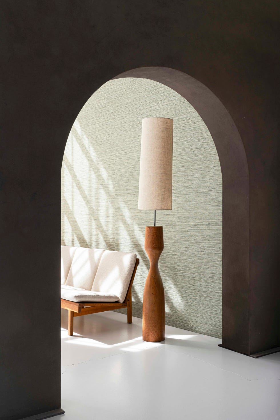 pampas wallcovering in a living room seen through an arch