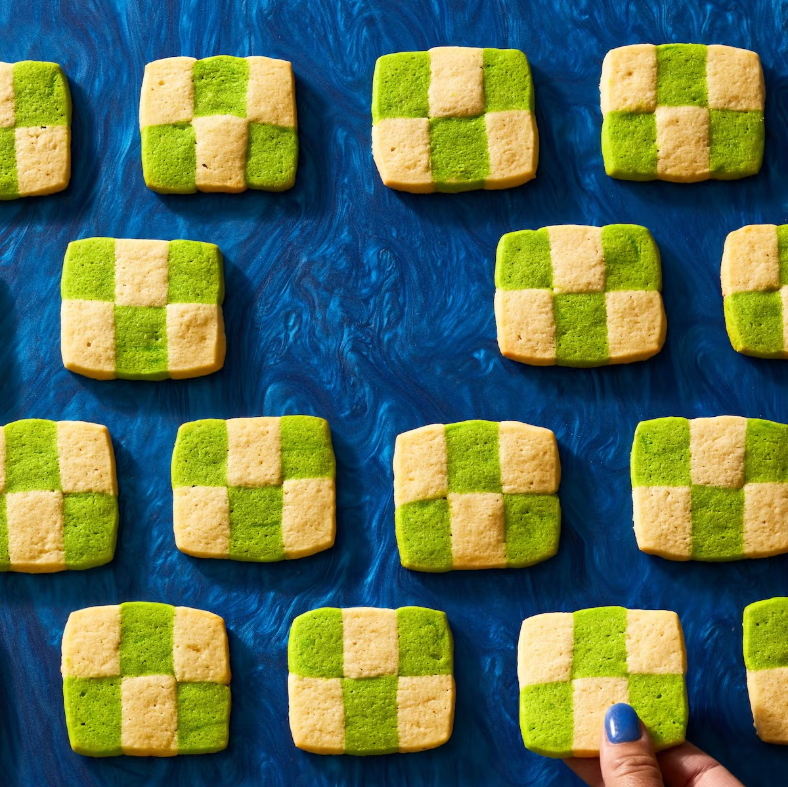 pandan checkerboard cookies with a grid design on a blue background
