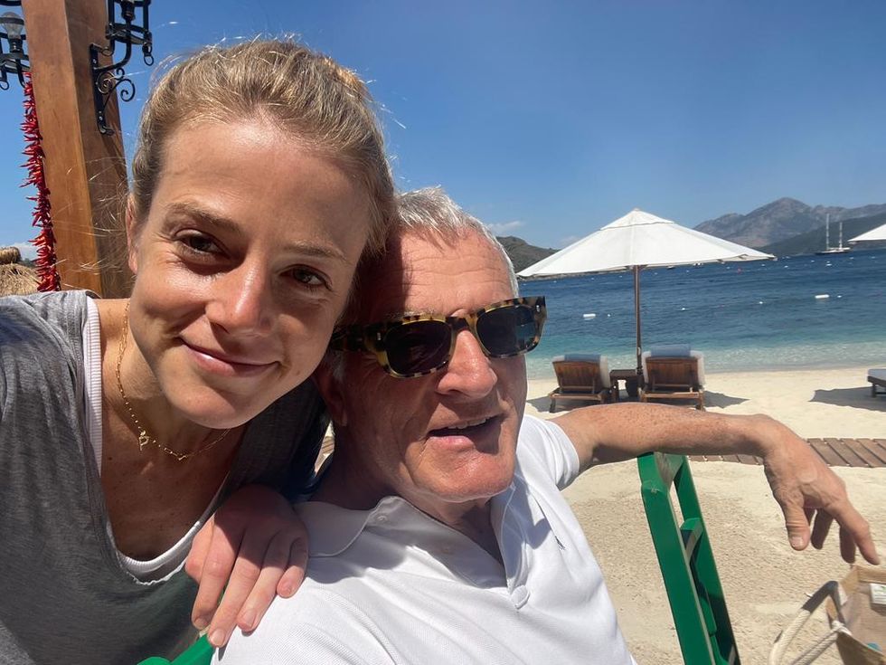 pandora and her dad smile in beach selfie