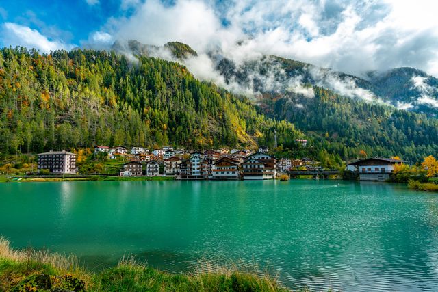 panoramic view of the lago di alleghe and masare village lake in the italian dolomites