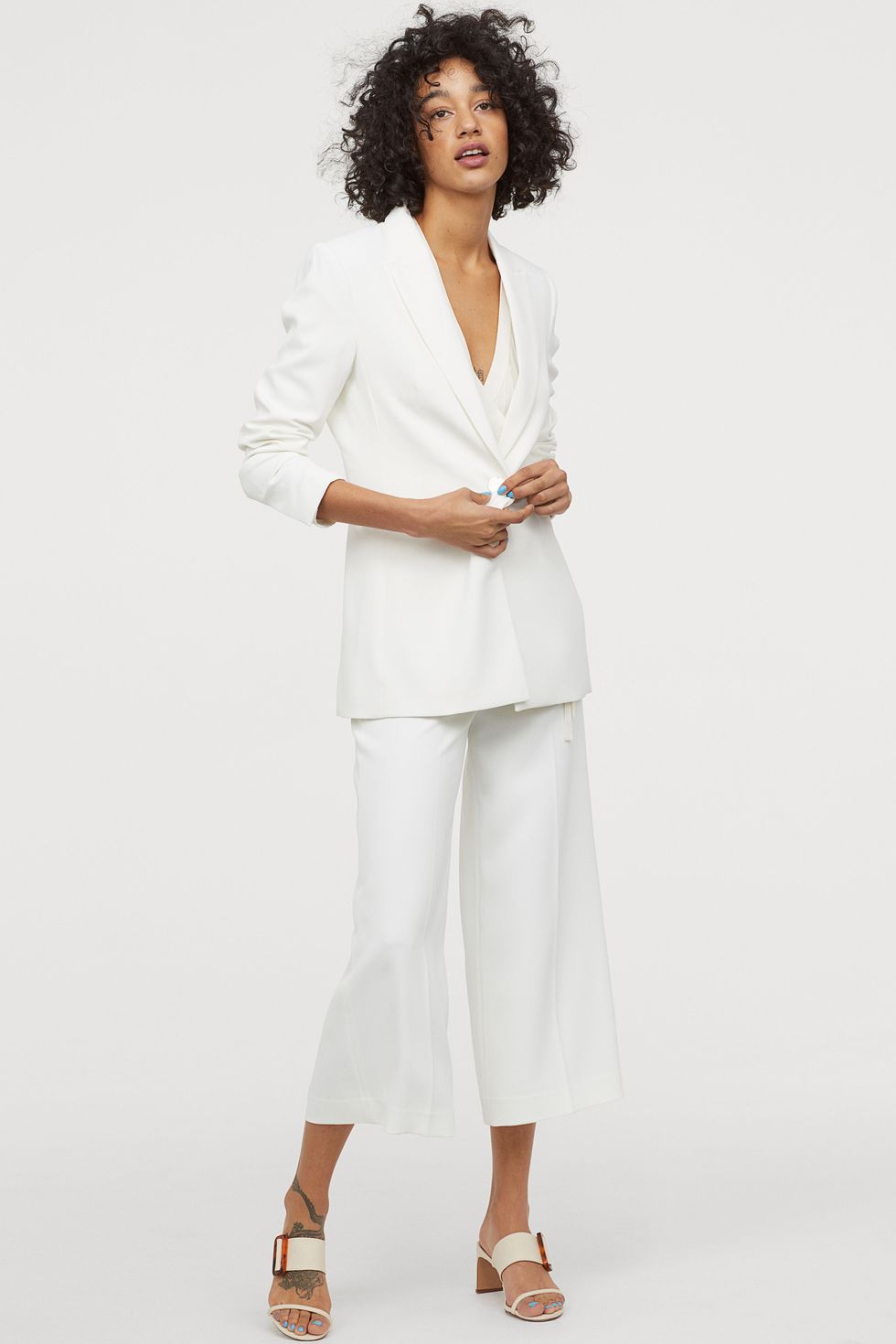 mordaz Lleno Aterrador Los pantalones blancos tipo culotte de vestir de H&M que van a mejorar tu  estilo 100% sin esfuerzo esta primavera