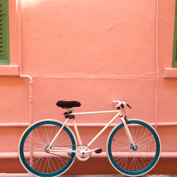 Bicycle, Bicycle wheel, Bicycle part, Red, Pink, Vehicle, Bicycle accessory, Orange, Bicycle handlebar, Bicycle tire, 