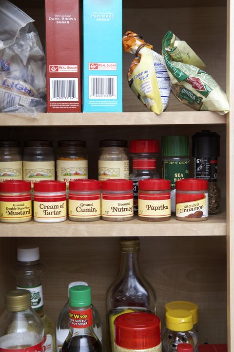 Pantry Cabinet Stocked with Spices and Condiments