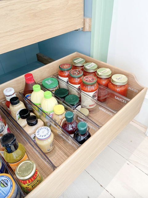 pantry organization ideas labeled bins in the open wood drawers with jars