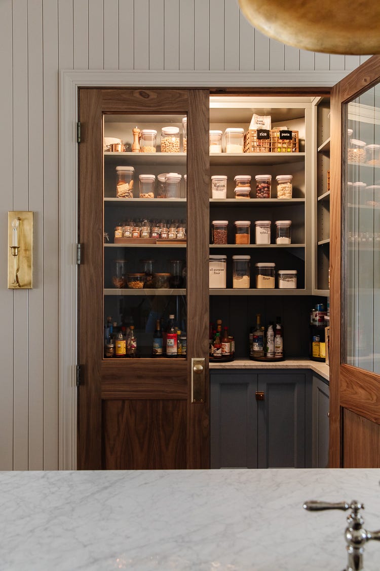 wellorganized pantry with glass doors showcasing various food items