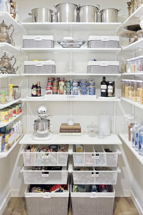 pantry organization ideas, white baskets and bins with cans of food on the shelves