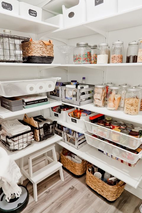 pantry organization ideas, white shelves with baskets of food and jars of food