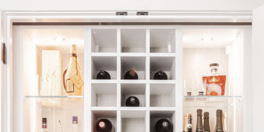 Organized shaker bottles in a wine rack and put protein powder in