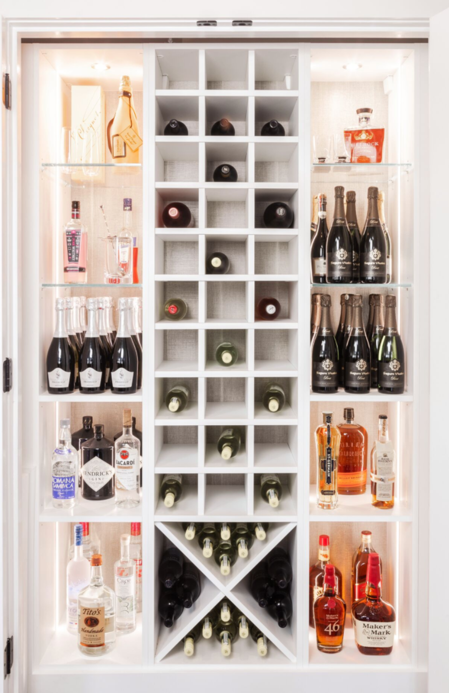 Organized shaker bottles in a wine rack and put protein powder in