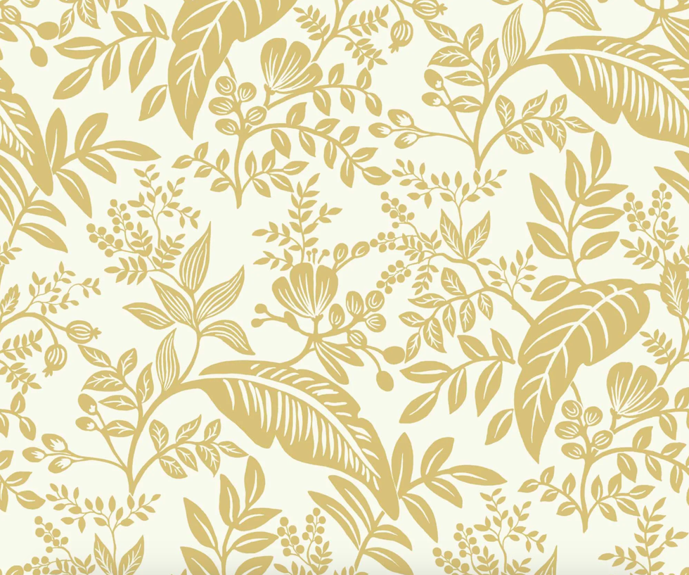 papel pintado con motivos botánicos exóticos en color dorado