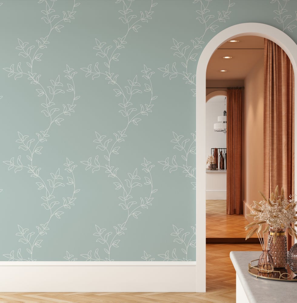 papel pintado verde con motivos botánicos