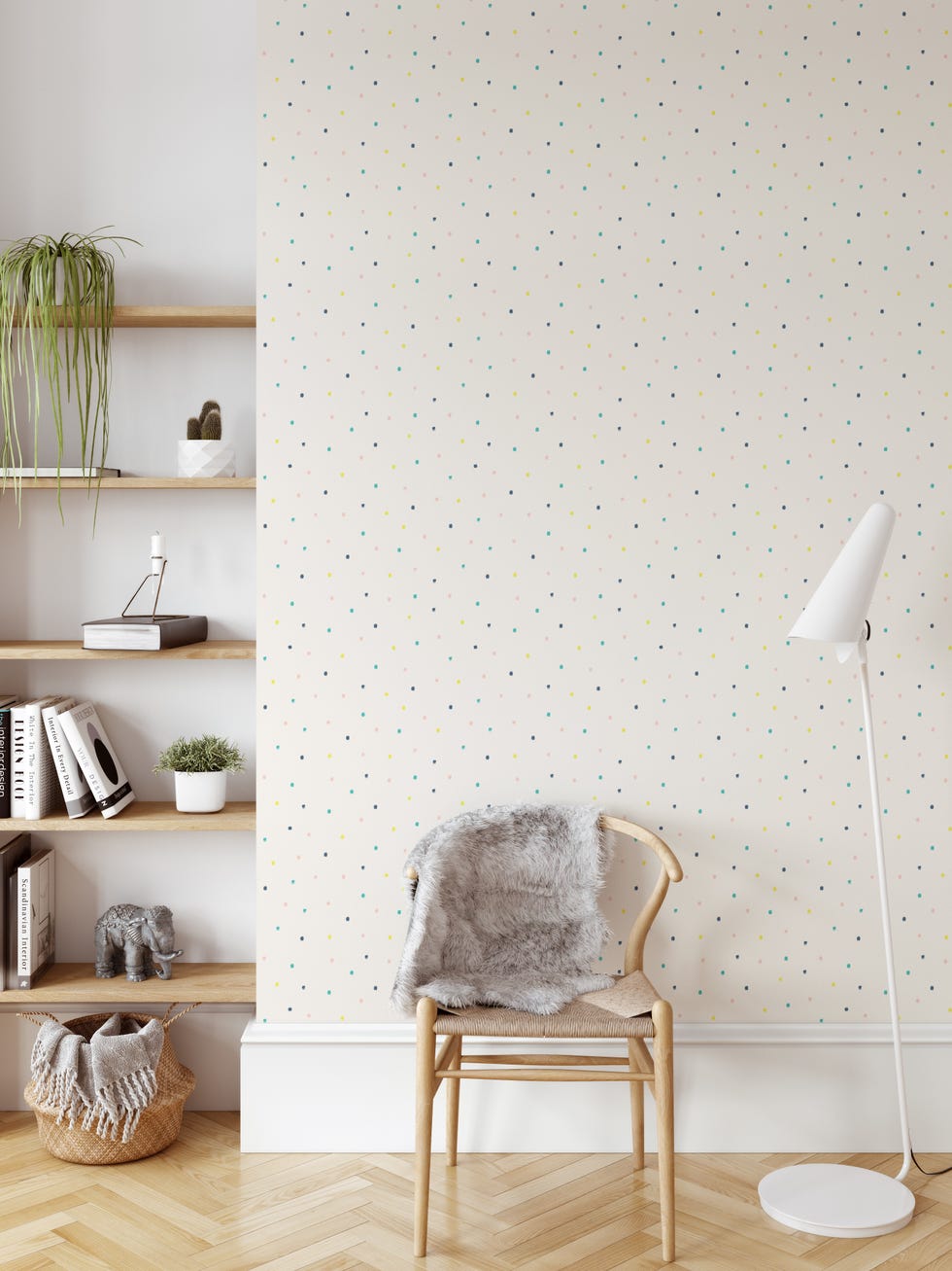 habitación infantil con papel pintado de puntitos de colores