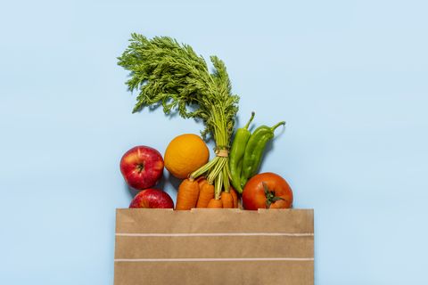 paper bag full of fruits and vegetables