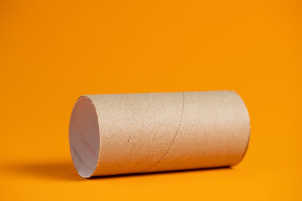 Paper roll on orange background.