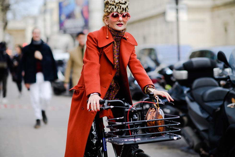 Street fashion, Orange, Fashion, Headgear, Vehicle, Fur, Winter, Coat, Street, Fashion accessory, 