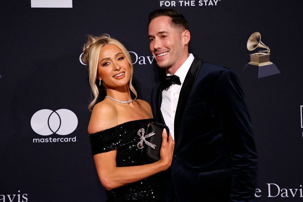 us socialite paris hilton l and husband us author carter reum arrive for the recording academy and clive davis pre grammy gala at the beverly hilton hotel in beverly hills, california on february 4, 2023 photo by michael tran afp photo by michael tranafp via getty images