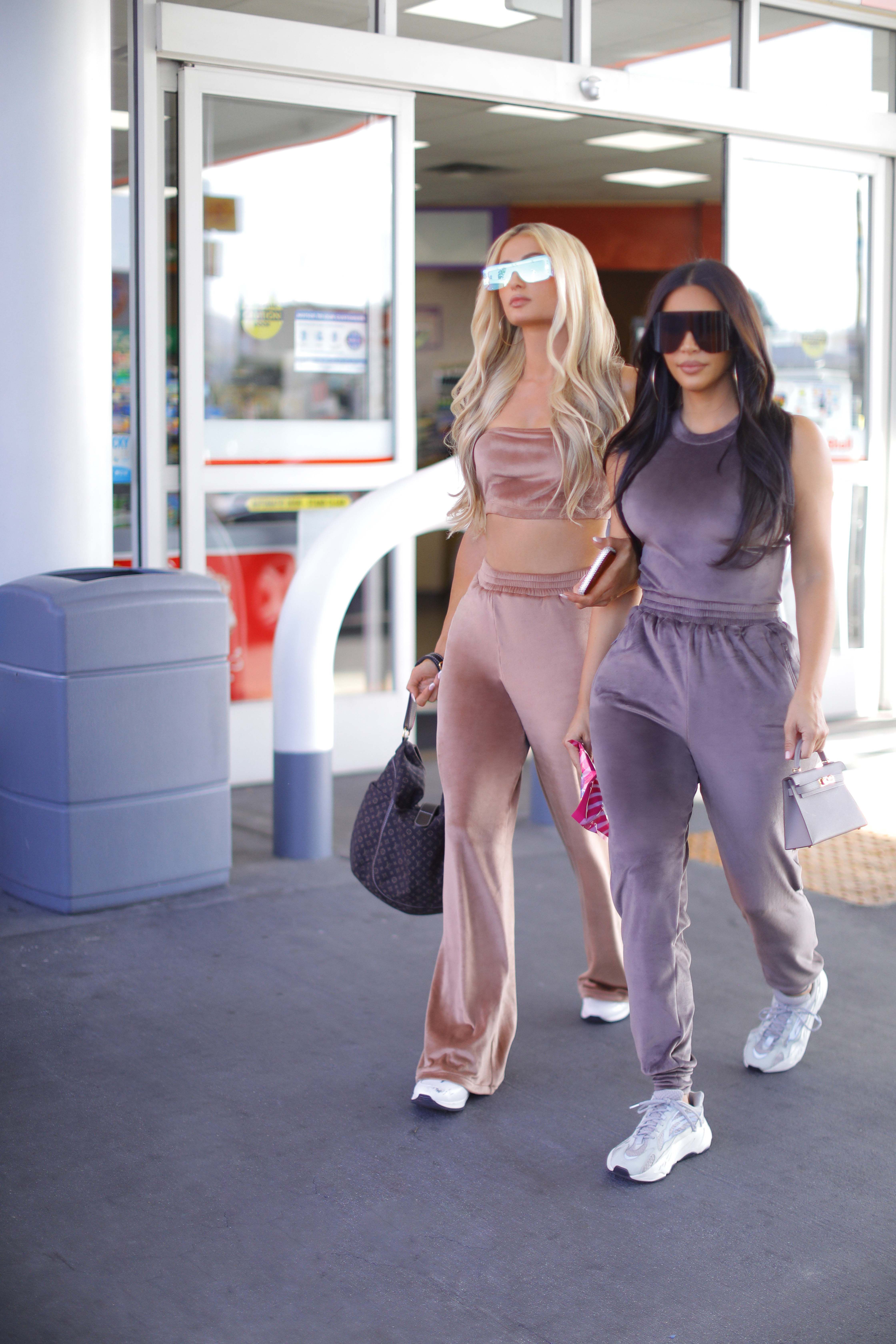 Kim Kardashian & Paris Hilton Channel The 2000s In Velour Tracksuits –  Footwear News
