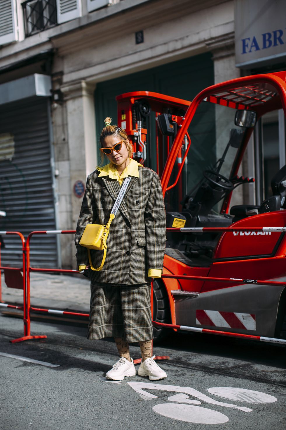Red, Transport, Yellow, Mode of transport, Workwear, Street fashion, Vehicle, Design, Street, Personal protective equipment, 