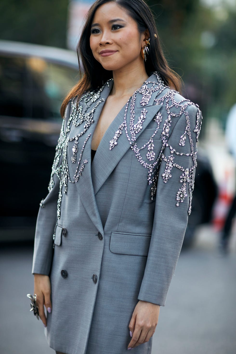 a woman in a grey suit