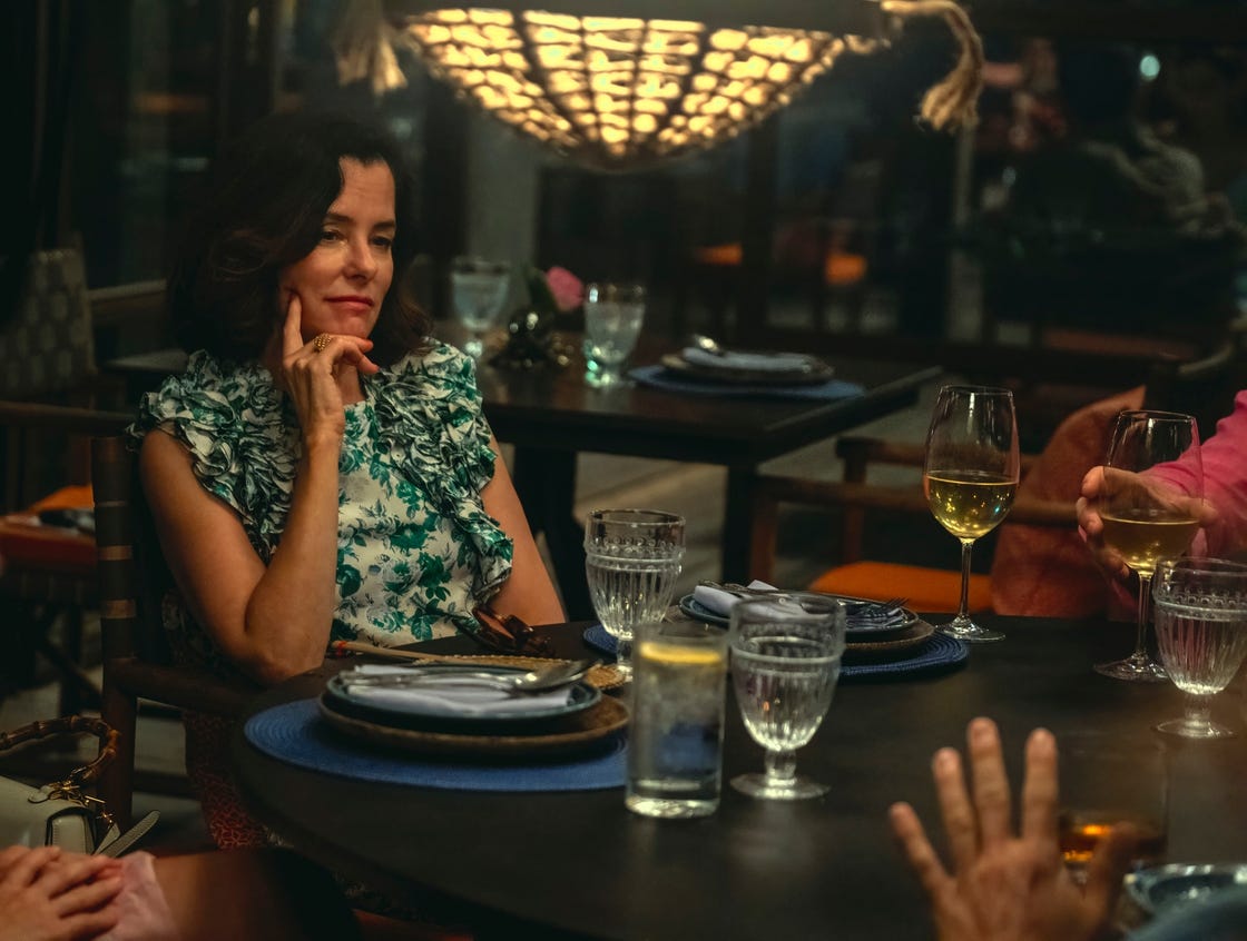 Indoor dining scene with a group of people around a table