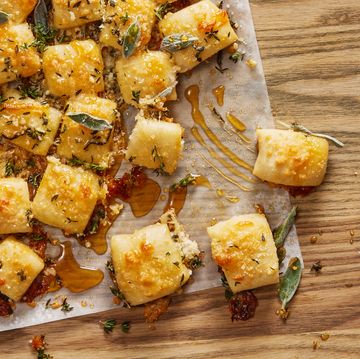 parmesan bread bites topped with sage and hot 
honey