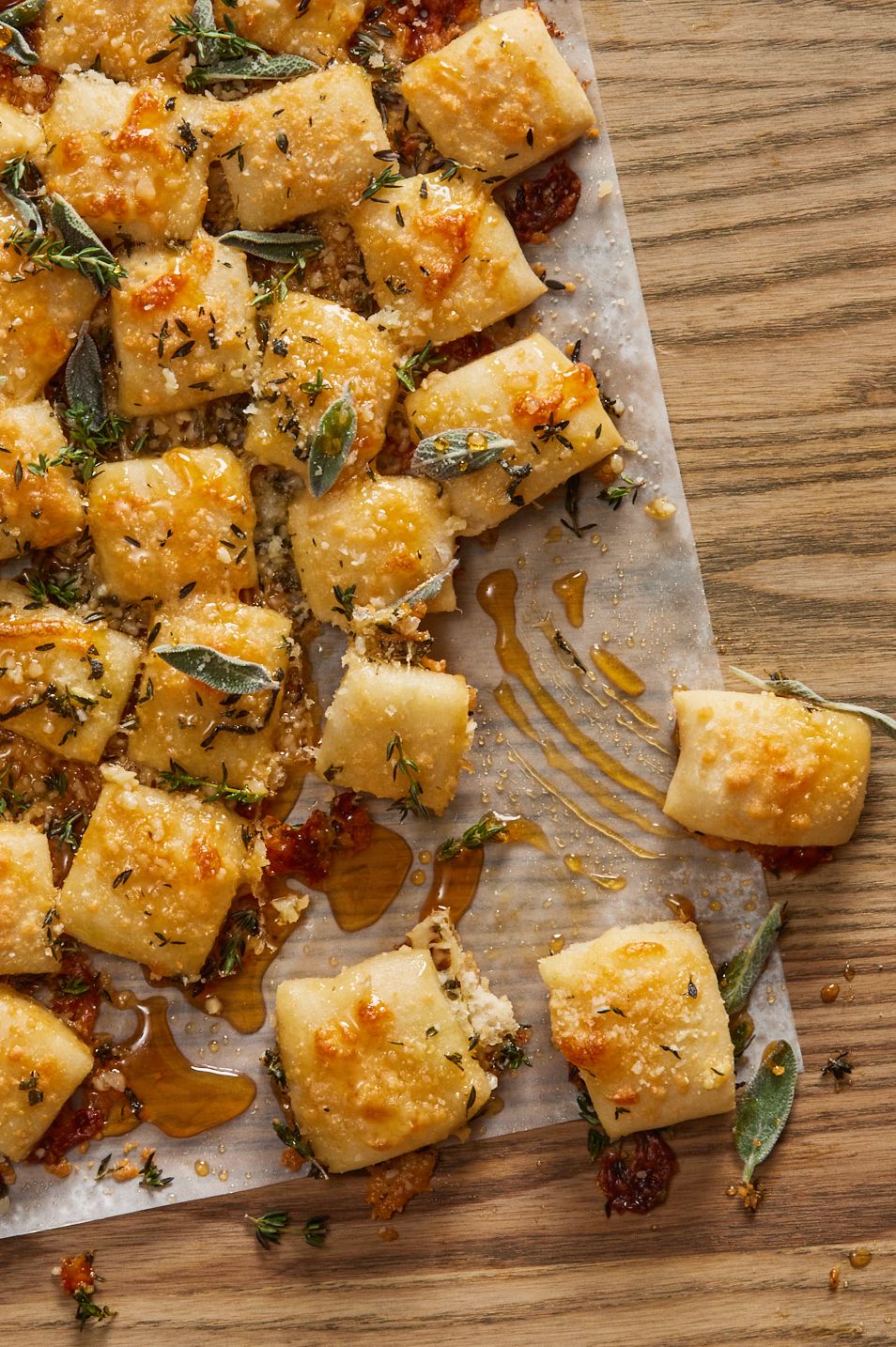 parmesan bread bites topped with sage and hot honey