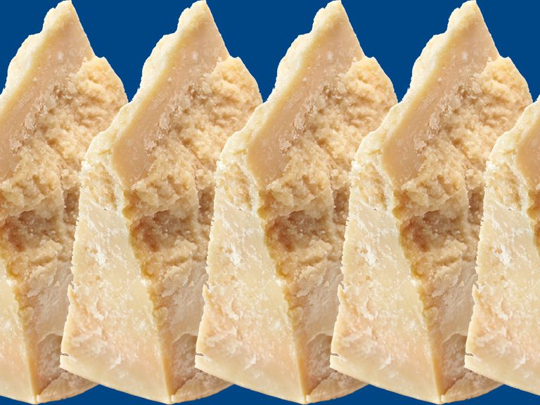 parmigiano reggiano wedges on a blue background
