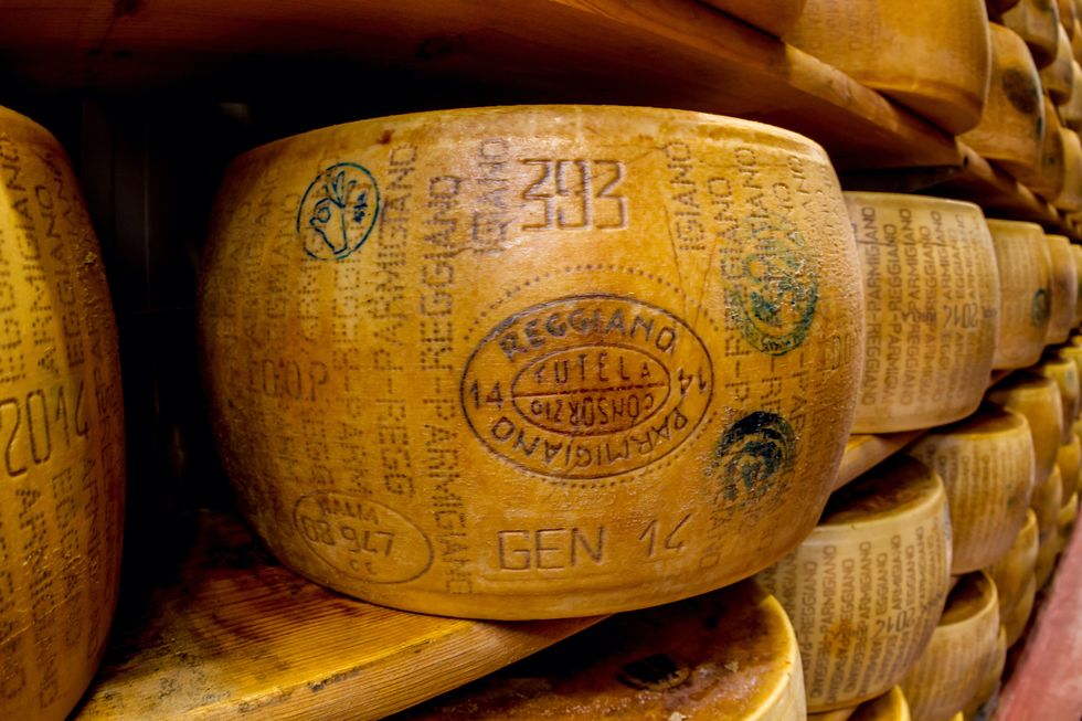 parmigiano reggiano or parmesan cheese, is a hard, granular cheese made in italy