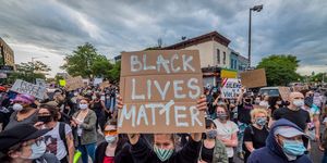 a participant holding a black lives matter sign at the