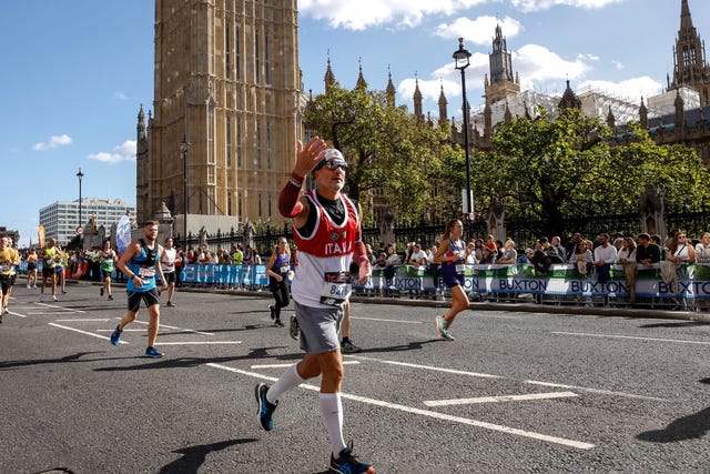 participants of tcs 2022 london marathon run past
