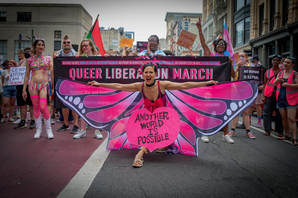 participants seen holding a banner at the march thousands