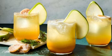 cocktail with a pear garnish and candied ginger