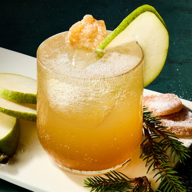cocktail with a pear garnish and candied ginger