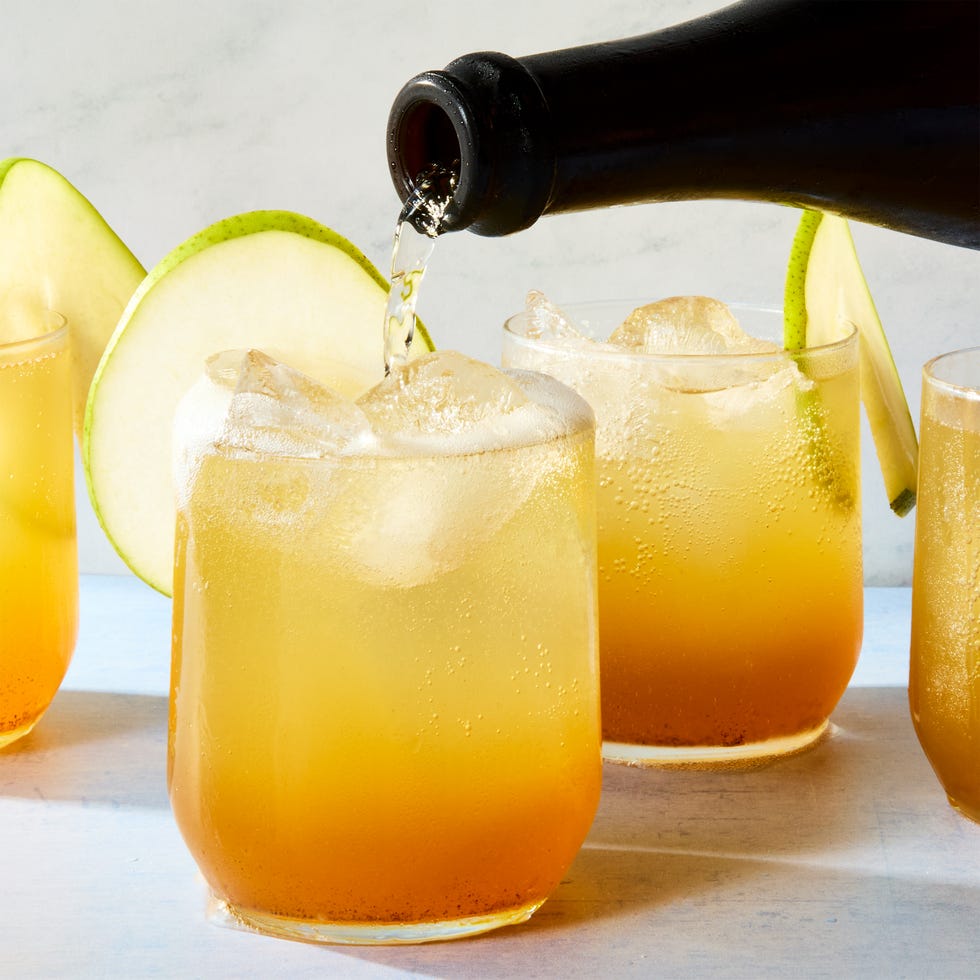 cocktail with a pear garnish and candied ginger