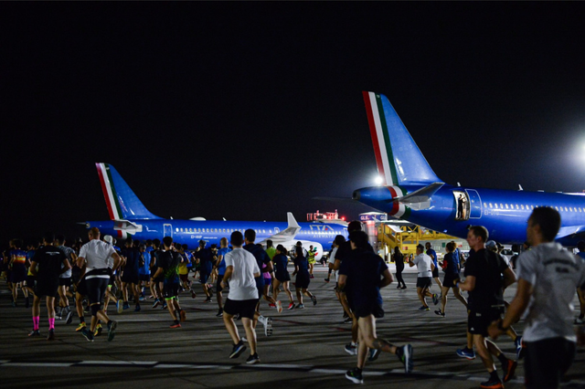 people walking near airplanes