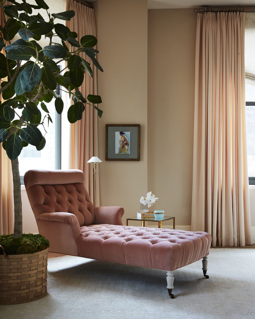 in the  bedroom a velvet 1920s french arm chaise in a mauve color