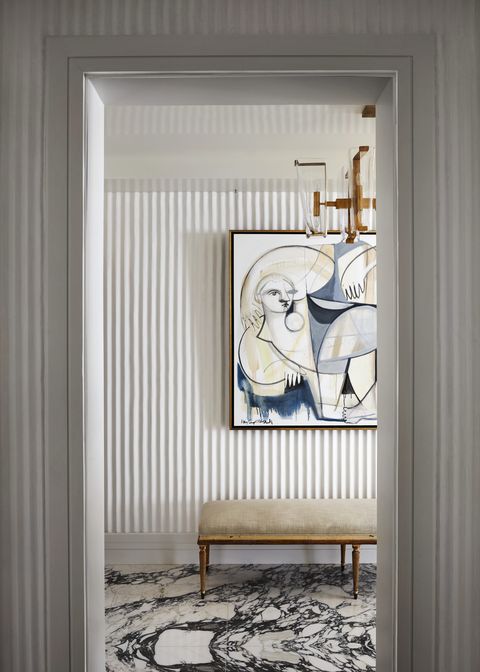 hand trawled fluted plaster elevates the walls in the entryway