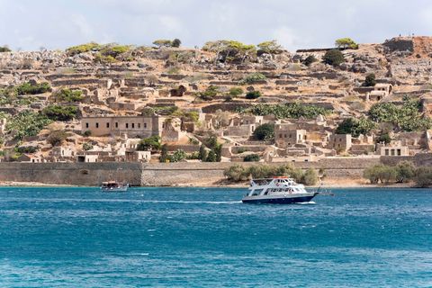 Passenger ferry off Spinalonga Island a former Leper Colony in northern Crete, Greece