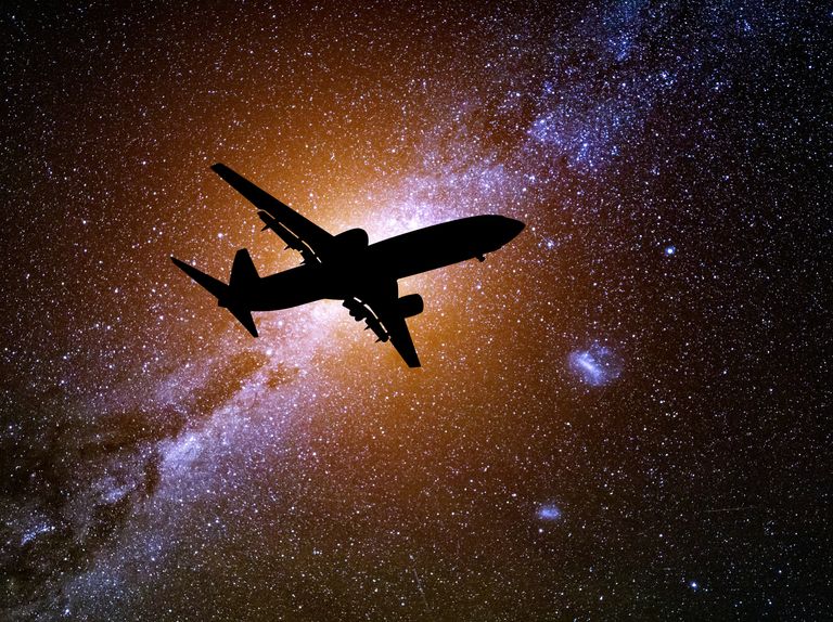 passenger plane against the background of the starry sky