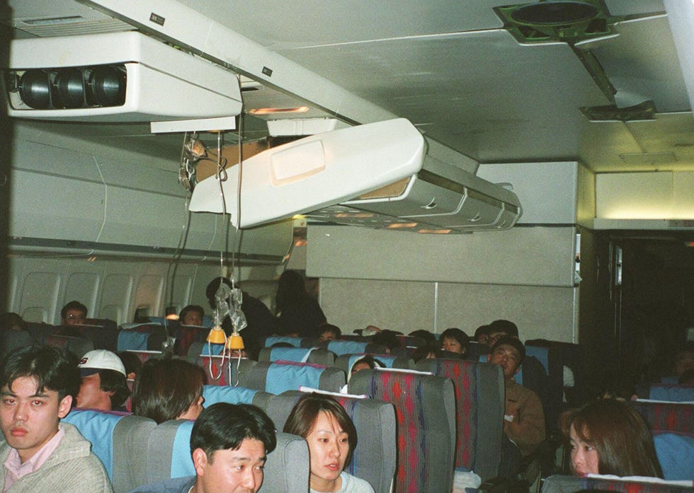 passengers aboard united airlines flight 826 sit u