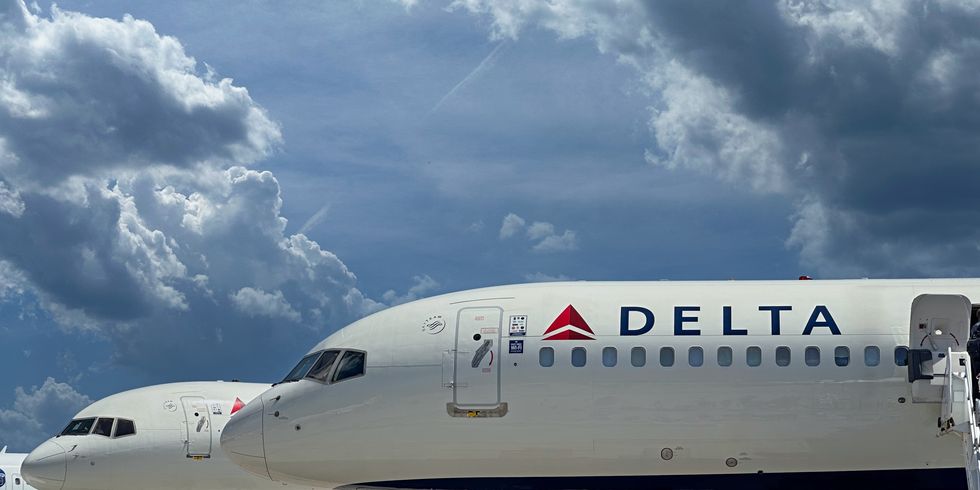 passengers boarding a delta airplane