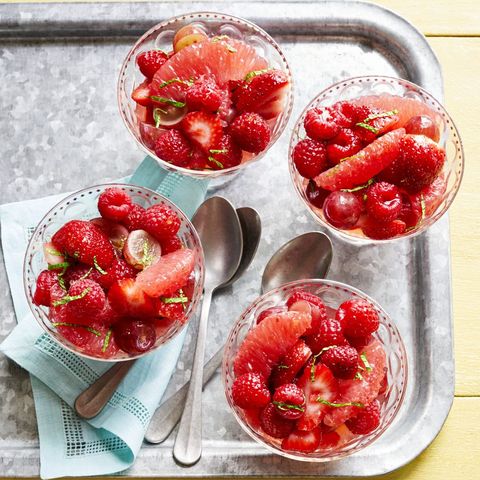 fruit salad with grapefruit vanilla syrup in glass cups on metal tray