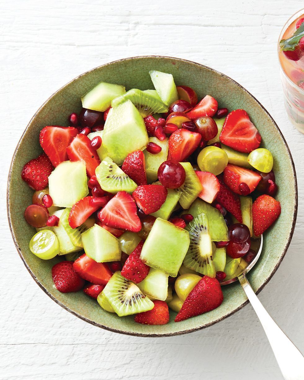 fruit salad with mint syrup kiwis strawberries and grapes
