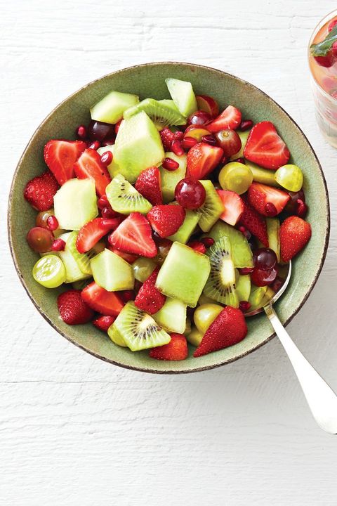 fruit salad with mint syrup kiwis strawberries and grapes