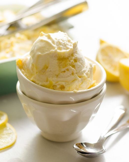 lemon curd ripple ice cream in white bowls stacked