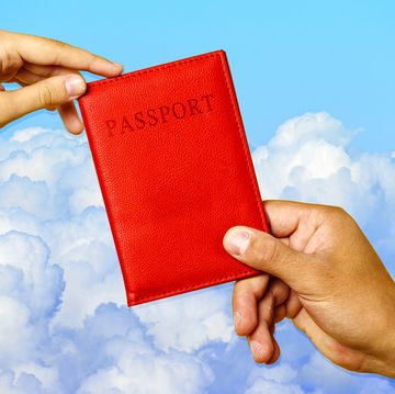 hands holding passport with cover
