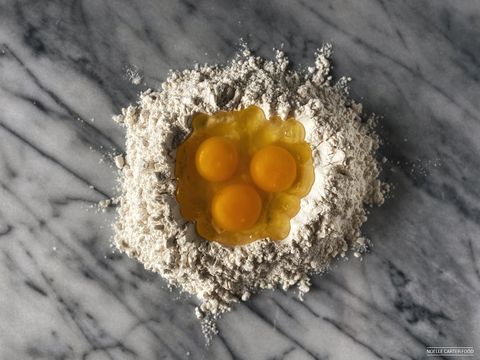 flour in with eggs for pasta preparation