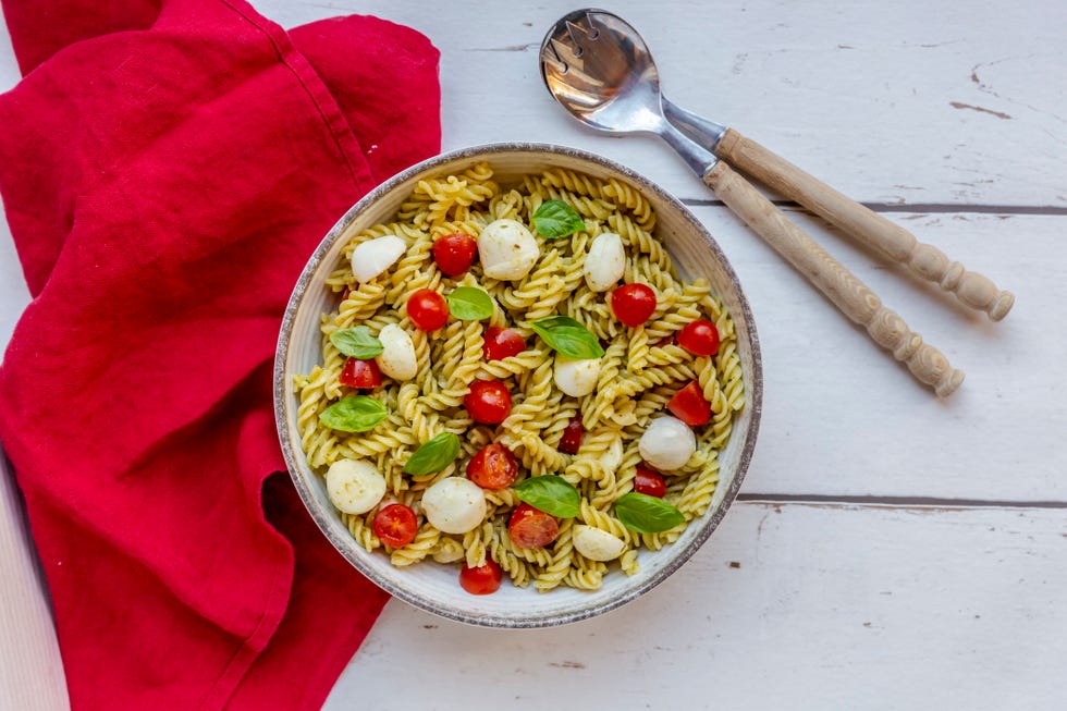 pasta salad with pesto, tomatoes, mozzarella and basil