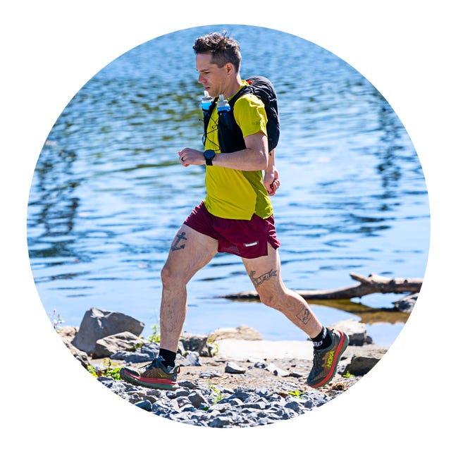 runner by water with hydration pack