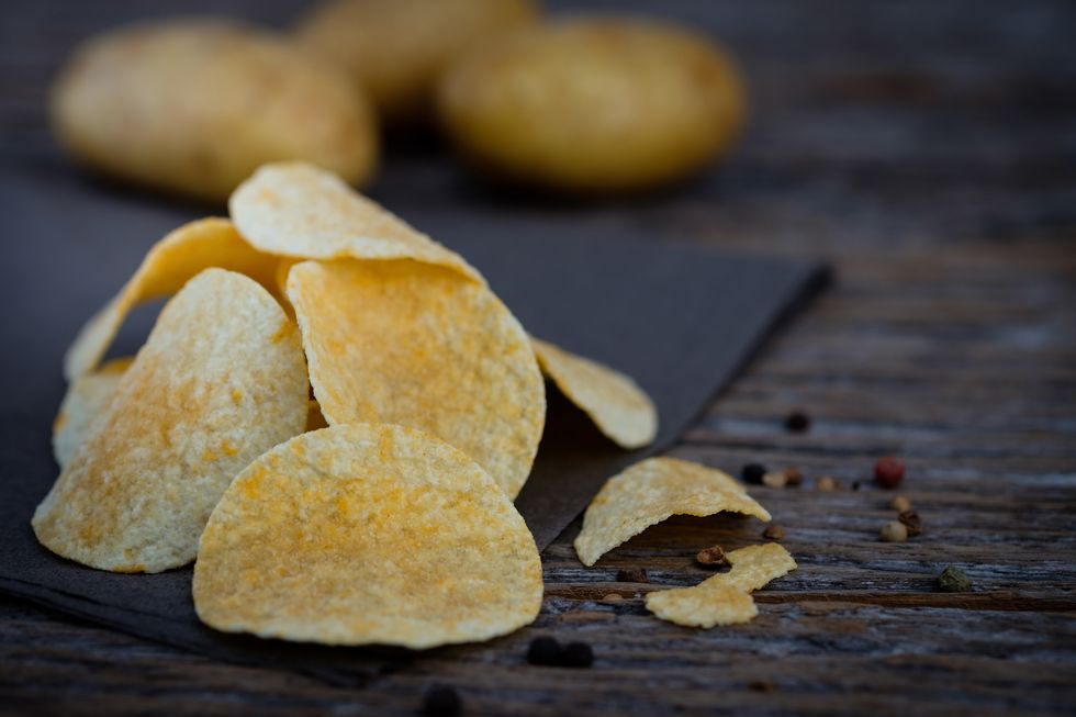 Close-Up Of Potato Chips On Table